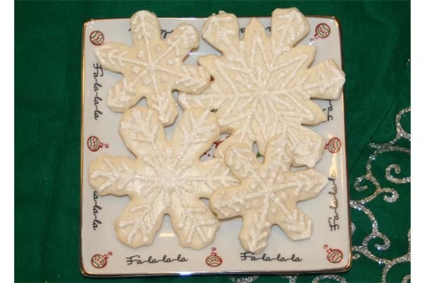 Snowflake Cookies Dipped in white choc, piped in royal icing, dipped in glitter. 3, 4 and 5 inch. Thanks to all the cookies on this site for ideas!