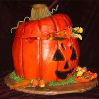 Jack O' Lantern Made from 2 8" rounds and 2 pyrex casserole dishes. Buttercream airbrushed. Had a blast making this. For a 7 year olds birthday.