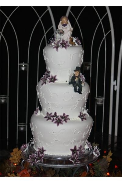 Cole-Coon Wedding This was my first attempt at a real cake shaped like my daisy cake. I decided it is a unstable design. It was really leaning forward by the...