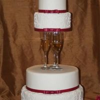 Champagne And Hearts buttercream with royal piping. 6, 8, 12 and 14 inch tiers