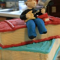 Graduation Guitar Player My first gum paste free-form 3D picture on top of 2 cake books covered in buttercream.