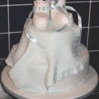 Lina's Baby Shower My first ever baby shower cake! Not too many baby showers here!! A variation on the booties theme!! Booties and blanket made from modelling...