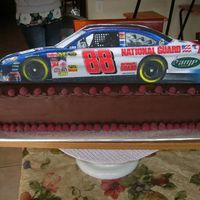 Nascar Cake Not my usual "style". My friend wanted me to use a huge 10"x30" felt race car pennant to decorate the cake with - I cut...