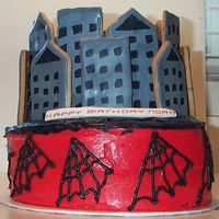 Spiderman Cake city is made out of cookies, cream cheese buttercream frosting, parent will put their own topper on the cake