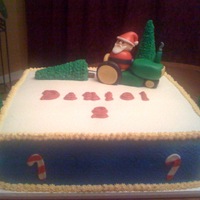 Christmas Birthday Cake Daniel wanted a santa on a tractor, pulling a christmas tree on his cake. This is what I came up with. TFL!