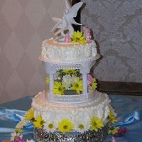 June Jubilee This cake is adapted from a Wilton design. It is carrot with spice buttercream and sweet peas down the sides. I also used fresh flowers.