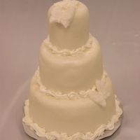 Mini Wedding Cake This is a styrofoam dummy mini wedding cake I made at the Mid-Michigan Sugar Art Workshops. It is covered in fondant and decorated with...