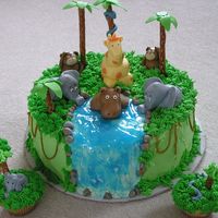 Jungle Friends This is my adaptation of another cake addicts cake. The cake is a chocolate layer cake decorated with buttercream. The animals are hand...
