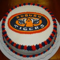 Auburn Tigers Cake This was a 10" 4 layer white cake with buttercream icing. The Auburn Logo was done in colorflow.