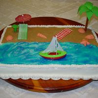 First Bridal Shower Cake All of the pieces on the beach(except the umbrella) were made from Wilton's fondant that I colored. The palm tree was a lot of trouble...