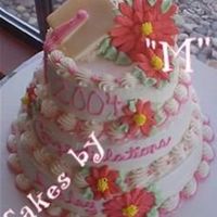 Graduation Cake this was for my best friend! those are always the best cakes to make! 10 - 8 -6 champagne cakes with bc frosting...royal icing gerbers and...