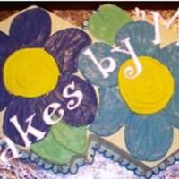 Daisies This (2 side by side- 15'' hexagon (w/ 2 - 6' hexes for leaves) cake is going to be turned into a character cake for a...