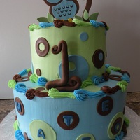 1St Birthday Cake 2 tiered chocolate cake. Owl made out of fondant, (copied from invitation).