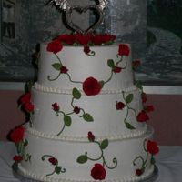 Rose Vine I made this cake for my Niece's wedding, they had a Medieval theme. The roses and leaves were made out of fondant.