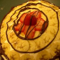 Banana Strawberry Cake i jus decided to bake a cake and this is what came out! ahah its a banana cake with vanilla icing. but i sliced up bananas and used it to...