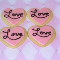 Heart Cookies Butter cookies with MMF. "Love" is piped with melted chocolate.