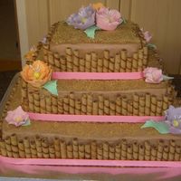 Hawaiin Wedding Cake This was my 1st wedding cake it is a 8,12,16 top is wasc with white chocolate rasberry coffee creamer with rasberry buttercream filling,...