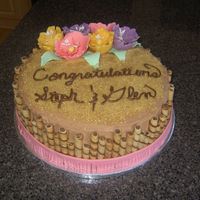 Luau Bridal Shower Cake 12 inch Yellow Cake with choclate ganache filling and chocolate icing decorated in gumpaste flowers