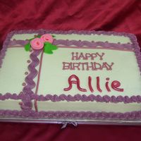 Purple Birthday Bc iced with fondant ribbon roses.