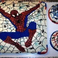 Spiderman all three cakes w/2 layer filling. 16-inch square...1/2 choc & 1/2 white, w/two 6-inch round cakes on the side. cream cheese frosting...