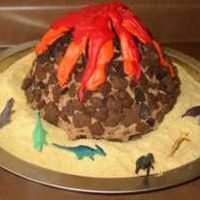 Volcano Decorated By Five And Four-Year-Old My sons' first cake. they baked and decorated it. Red velvet cake with chocolate buttercream, crushed oreos and teddy grahams, topped...