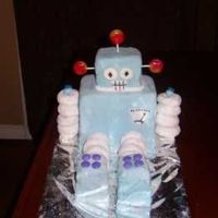 Robot Cake Robot cake for my son's fourth birthday. powdered doughnut arms and legs.