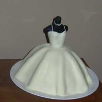 Wedding Gown My first dress/doll cake. Made it for my sister-in-laws shower. I am pretty pleased with it. Wanted to add a little more detail, but was...