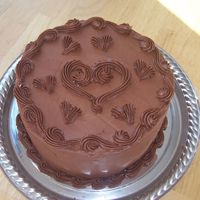 Chocolate/strawberry 4 Layer Cake chocolate buttercream, four layers of dark chocolate cake with strawberry filling.