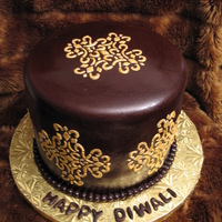 Diwali Cake Cake for India's celebration of lights Diwali. Choc. fondat with royal icing stencil and painted with gold luster dust.