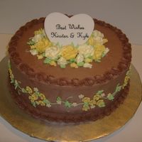 Wedding Rehearsal Dinner Cake Made for a wedding reheasal dinner. 12" dark chocolate and vanilla cake w/ raspberry filling, chocolate BC, fondant and BC decorations...