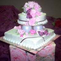 Mini Tier Single layer 8" square, 6" round top, strawberry cake, BC icing, royal icing roses and fabric butterflies (didn't have time...