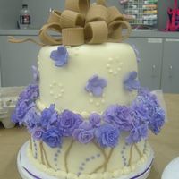 Purple Rose My first Fondant roses, colored with luster dust. Patterned after a Sugar Creations cake. White Chocolate Rasperrry cake with Raspberry...