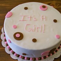 Its A Girl! round cake covered in fondant with fondant circles. pink and brown theme. first cake (other than in Wilton class) that I covered completely...