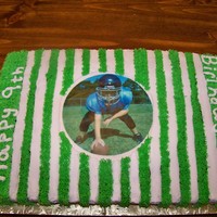 Football Field Cake edible image of football player. the rest covered in buttercream icing.