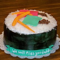 Sushi Cake outside covered in fondant topped with coconut and fondant pieces.