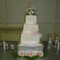 Jinnifer This is our first paid wedding cake! The bottom tier is double white chocolate chip, the second tier is german chocolate with buttered...