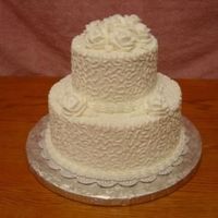 Sarah Requested all white cake with white roses. All buttercream. Sizes: 10-6. White cake with pineapple filling.