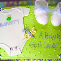 F.r.o.g. Onesie And Booties Cake This is my first "real" cake. It's for a baby shower for my church's youngest F.R.O.G. (our children's ministry...