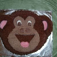 Monkey Cake This was the second cake done for my son's 3rd birthday. Banana cake and chocolate whipped frosting star tip#16 used. Cracker pan idea...