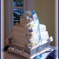 Zung's Touch Of Blue This cake originally was to have separations filled with fresh flowers, but bride only gave us a handful of buds to work with. Thankfully...