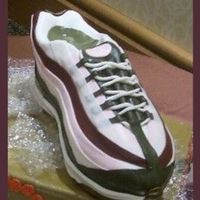 Debbine's Shoe 2 This is the close up view 3D carved cake, used my hubby's real shoe wrapped in plastic for a template. Covered in mmf. This was pretty...