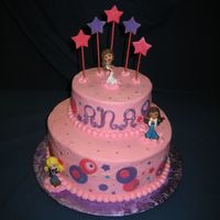 Bratz Cake Buttercream with MMF accents and plastic Bratz cake toppers. The little girl I did this for wanted the geometric circles.