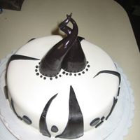 Black And White This was a birthday cake I made for a co-worker. It was quite what I had planned but sheloved it and I guess that's what is important...