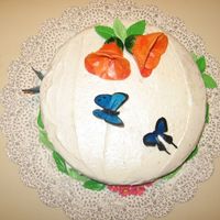 Butterfly Cake I made this cake for my sister's birthday. First time trying rice paper butterflies. It was fun! Flowers and leaves are gumpaste. Used...