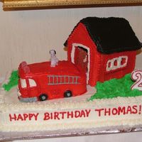 Dscf2219.jpg This was for my son's second birthday. 1/2 sheet cake with a gingerbread fire station and a loaf pan for the fire truck. The dog is a...