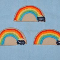 St. Patrick's Day Cookies Rainbow with the pot of gold at the end. Pot is colorflow and the gold and raibow are royal icing.