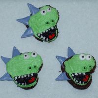 Dino Cupcakes I made these for my son's 4th birthday party at his preschool. I got the idea from some cookies posted on CC and then used buttercream...