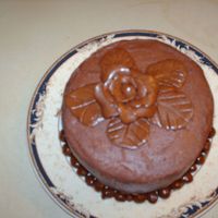 Just For Practice This is a 5" vanilla cake with chocolate b/c cream frosting with mmf bottom boarder and a tootsie roll rose. Had fund doing this one I...