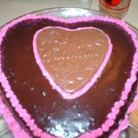 Valentines Day choc cake/bc filling and piping ganache topping with choc valentines heart plaque. Made for dh for valentines day he said it was better...