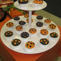 Halloween Dot Cakes Cupcakes with fondant polka dots. I used a large biscut cutter to create the scolloped edges.